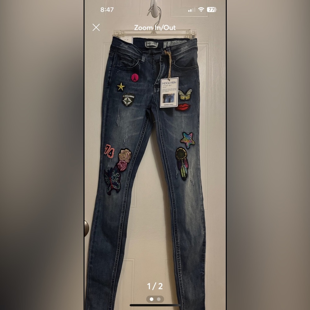 embroidered patches,buttons,Indigo Rein's  skinny jeans.,ankle style